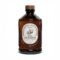 Sirop de caramel Bacanha avec une cuillère de caramel coulant