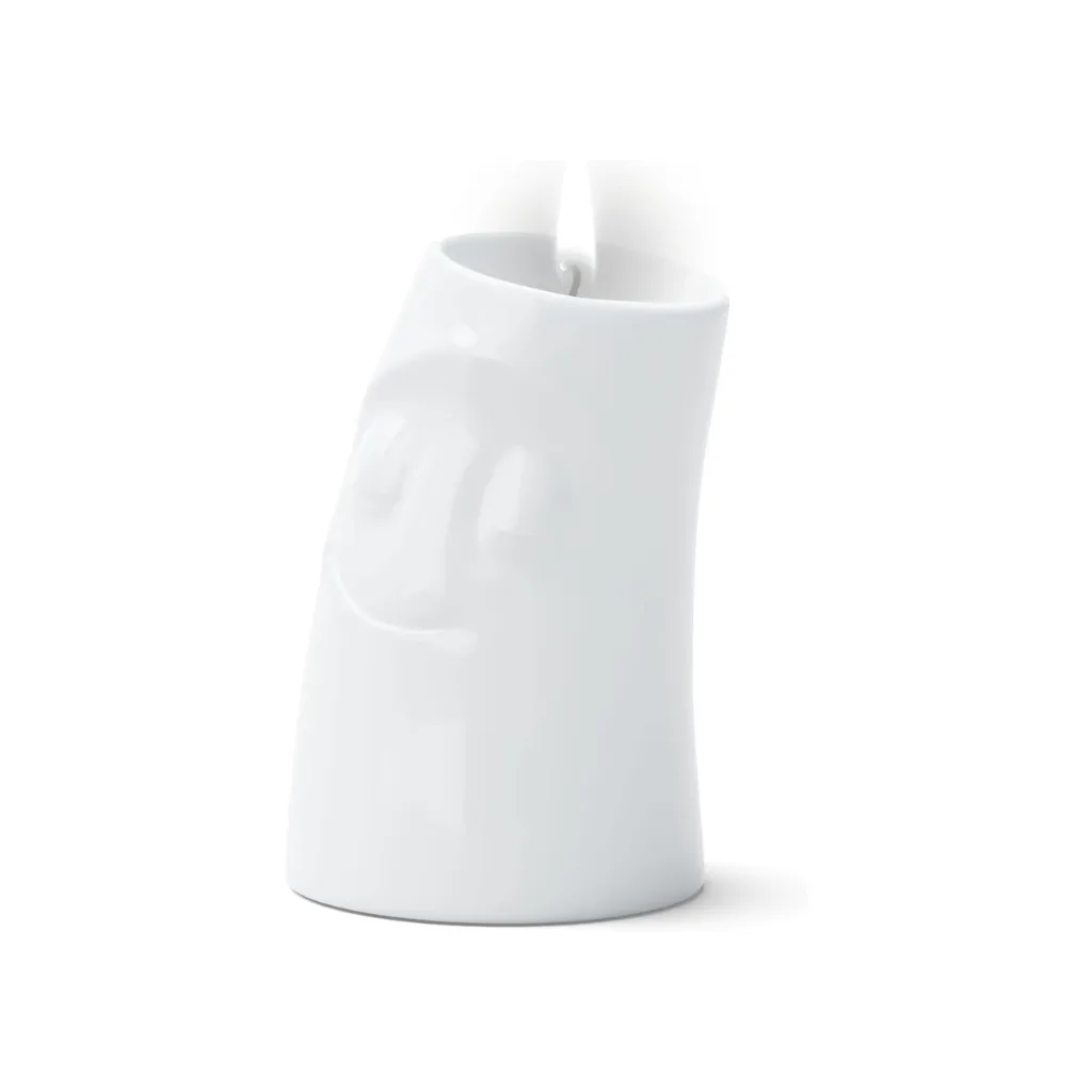 Bougeoir allumé diffusant une lumière douce dans une ambiance cosy.