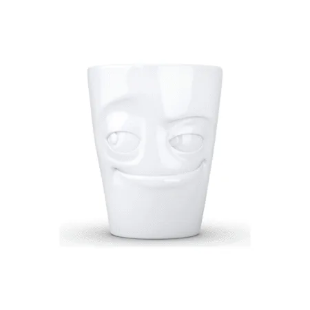 Mug avec anse affichant un visage malin et espiègle.