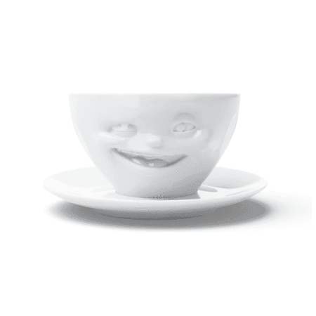 Tasse à thé en céramique avec visage faisant un clin d'œil, vue de face