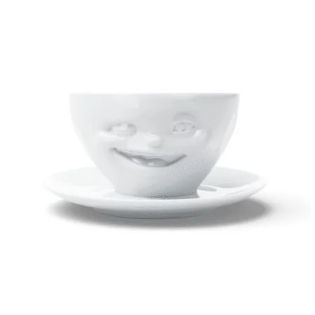 Tasse à thé en céramique avec visage faisant un clin d'œil, vue de face
