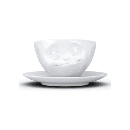 Tasse à thé avec visage tirant la langue, expression gourmande, vue de face