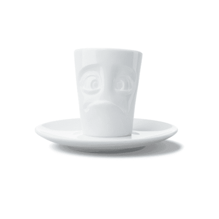 Tasse à expresso en céramique avec expression suppliante, vue de face