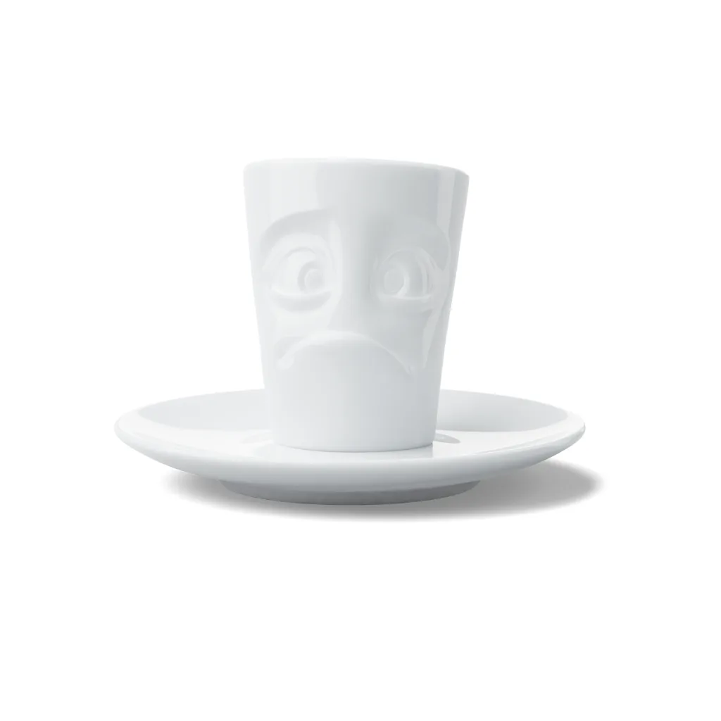 Tasse à expresso en céramique avec expression suppliante, vue de face