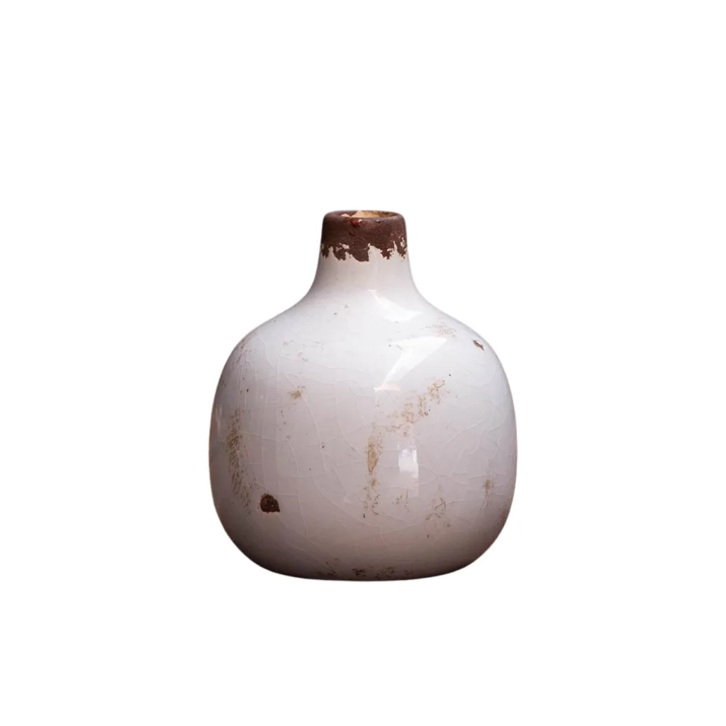 Vase rond blanc en céramique, finition brute, texture patinée
