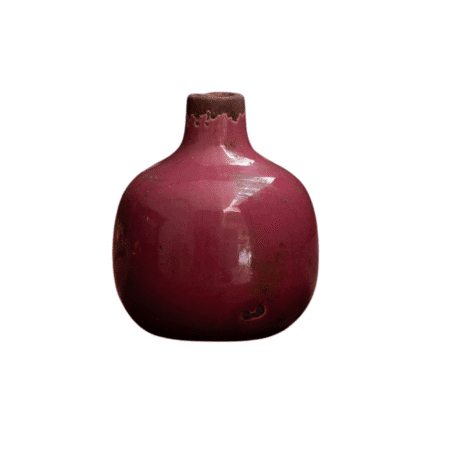 Vase rond rose foncé en céramique, texture brute et patine vieillie
